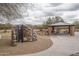 A shaded picnic area features tables, benches, and a climbing structure to sit and enjoy the view of the community at 1712 W Aloe Vera Dr, Phoenix, AZ 85085