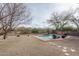 Sparkling pool surrounded by desert landscaping and mountain views at 1712 W Aloe Vera Dr, Phoenix, AZ 85085