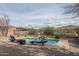 Relaxing pool area with lounge chairs, waterfall, and mountain views at 1712 W Aloe Vera Dr, Phoenix, AZ 85085