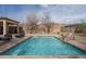 Lush outdoor oasis with a private pool, patio space and rock feature at 1712 W Aloe Vera Dr, Phoenix, AZ 85085