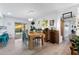 Bright dining room with a rustic wooden table, adjacent to the patio door at 1715 Leisure World --, Mesa, AZ 85206