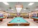 Wide angle shot of a spacious game room featuring multiple pool tables, ideal for relaxation and entertainment at 1715 Leisure World --, Mesa, AZ 85206