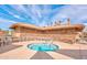 Relaxing hot tub surrounded by chairs, featuring a stone exterior and beautiful tile work at 1715 Leisure World --, Mesa, AZ 85206