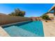 Sparkling pool features a shallow end for relaxing, complemented by a tile surround and privacy wall at 1715 Leisure World --, Mesa, AZ 85206