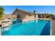 Private backyard features a refreshing pool, spa, waterfalls and ample patio space perfect for outdoor entertaining at 1715 Leisure World --, Mesa, AZ 85206