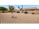 Desert-landscaped backyard with block fence providing privacy and sparse desert vegetation at 17828 N 50Th St, Scottsdale, AZ 85254