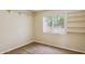 Cozy bedroom featuring a window with blinds and built-in shelves, carpet flooring at 17828 N 50Th St, Scottsdale, AZ 85254