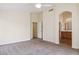 Comfortable main bedroom with carpet, ceiling fan, ensuite bathroom access, and relaxing atmosphere at 17828 N 50Th St, Scottsdale, AZ 85254