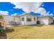 Spacious backyard featuring a well-manicured lawn and an outdoor patio with seating at 1840 E Jarvis Ave, Mesa, AZ 85204