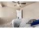 Cozy bedroom featuring plush carpeting, a ceiling fan, and neutral-toned decor at 1840 E Jarvis Ave, Mesa, AZ 85204