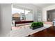 Bright dining room with a view of the backyard and a wood dining table at 1840 E Jarvis Ave, Mesa, AZ 85204