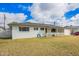 Charming single-story home featuring a welcoming porch, a well-maintained lawn, and an attached garage with an open carport at 1840 E Jarvis Ave, Mesa, AZ 85204