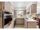 Bright kitchen featuring stainless steel appliances, granite countertops, and ample cabinet space at 1840 E Jarvis Ave, Mesa, AZ 85204