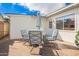 Outdoor patio with a dining table, umbrella, and comfortable seating at 1840 E Jarvis Ave, Mesa, AZ 85204