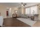 Inviting living room with dark wood floors, a comfortable seating area, and a view into the hallway at 21145 E Via De Olivos --, Queen Creek, AZ 85142