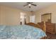 Bright main bedroom with wood floors, a wooden dresser, a large window and a view into the Primary bath at 21145 E Via De Olivos --, Queen Creek, AZ 85142