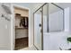 Bathroom featuring a walk-in shower, walk-in closet, and tile flooring at 2185 N Beverly Pl, Buckeye, AZ 85396