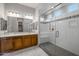 Modern bathroom with a glass-enclosed shower and double vanity at 2887 W Chevelon Dr, Queen Creek, AZ 85144