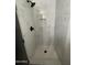 Modern bathroom shower with marble-look tile, black showerhead, and built-in niche at 291 N Washington St, Chandler, AZ 85225