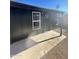 Exterior view of house with dark siding and black trim at 291 N Washington St, Chandler, AZ 85225