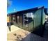 Exterior view of house with dark siding and black trim at 291 N Washington St, Chandler, AZ 85225