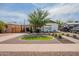 Charming single-story home with a well-manicured front yard and tasteful landscaping at 291 N Washington St, Chandler, AZ 85225