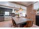 Kitchen with white cabinets, modern lighting, stainless steel appliances, and large center island with seating at 291 N Washington St, Chandler, AZ 85225