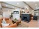 Comfortable living room featuring a cozy seating area, rustic fireplace, and open layout at 291 N Washington St, Chandler, AZ 85225