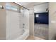 A clean and functional bathroom shows a tub and shower combination with white tiles that extends to a large bedroom at 2929 E Binner Dr, Chandler, AZ 85225