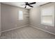 Inviting bedroom filled with natural light from two windows, complete with a fan at 2929 E Binner Dr, Chandler, AZ 85225