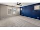 A spacious bedroom with neutral walls, a ceiling fan and shutters on the windows is bright with natural light at 2929 E Binner Dr, Chandler, AZ 85225