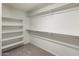 Spacious walk-in closet offers ample storage space with built-in shelving and metal rods at 2929 E Binner Dr, Chandler, AZ 85225