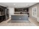 A well-lit kitchen featuring stainless steel appliances, granite countertops, tile backsplash, and a spacious center island at 2929 E Binner Dr, Chandler, AZ 85225