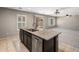 An island with sink and dishwasher is featured, while a living space extends to the right, with large windows at 2929 E Binner Dr, Chandler, AZ 85225
