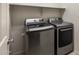 Laundry room featuring front load washer and dryer with convenient shelving above at 2929 E Binner Dr, Chandler, AZ 85225