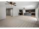 A large open-concept living room flows into the kitchen with modern appliances and a cozy atmosphere at 2929 E Binner Dr, Chandler, AZ 85225