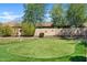 Beautiful backyard featuring a well-manicured green with a custom putting green at 2994 E Sports Ct, Gilbert, AZ 85298