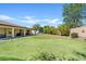 Spacious backyard featuring covered patio, synthetic putting green, and manicured landscaping at 2994 E Sports Ct, Gilbert, AZ 85298