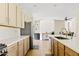 Bright kitchen with quartz counters, stainless steel appliances, island with sink and cabinetry at 2994 E Sports Ct, Gilbert, AZ 85298