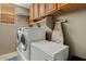 Laundry room with a washer, dryer, and ample storage space at 2994 E Sports Ct, Gilbert, AZ 85298