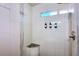 Modern bathroom shower with white tile, glass door, and built-in bench at 3041 S Country Club Way, Tempe, AZ 85282