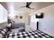 Well-lit bedroom with twin beds, television, and a large window providing natural light at 3041 S Country Club Way, Tempe, AZ 85282