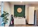 Dining area with a coffee bar, decorative clock, and modern appliances at 3041 S Country Club Way, Tempe, AZ 85282