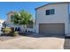 Modern two-story home with a two-car garage, desert landscaping, and a privacy gate at 3041 S Country Club Way, Tempe, AZ 85282