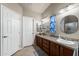 Bright bathroom featuring a long vanity, framed mirror, and a walk-in shower with a glass door at 3301 S Goldfield Rd # 3005, Apache Junction, AZ 85119