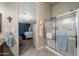 This bathroom features a glass enclosed shower and adjoins the main bedroom at 3301 S Goldfield Rd # 3005, Apache Junction, AZ 85119