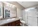 Well-lit bathroom with a vanity sink, toilet, and enclosed shower, providing essential amenities at 3301 S Goldfield Rd # 3005, Apache Junction, AZ 85119