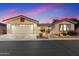 Charming single-story home with a two-car garage, a covered patio, and desert-style landscaping at 3301 S Goldfield Rd # 3005, Apache Junction, AZ 85119