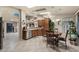 Well-lit kitchen featuring tiled floors, stainless steel appliances, and a cozy dining area at 3301 S Goldfield Rd # 3005, Apache Junction, AZ 85119