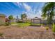 Large backyard with a gazebo, shed, and blooming bushes at 332 N 25Th St, Mesa, AZ 85213